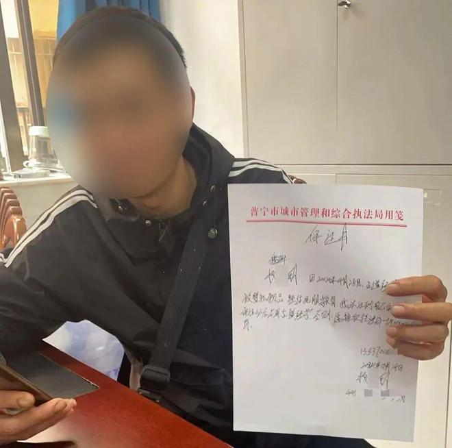 揭阳一摊贩长期占道乱摆卖！车钥匙被依法暂扣并写下保证书(图1)